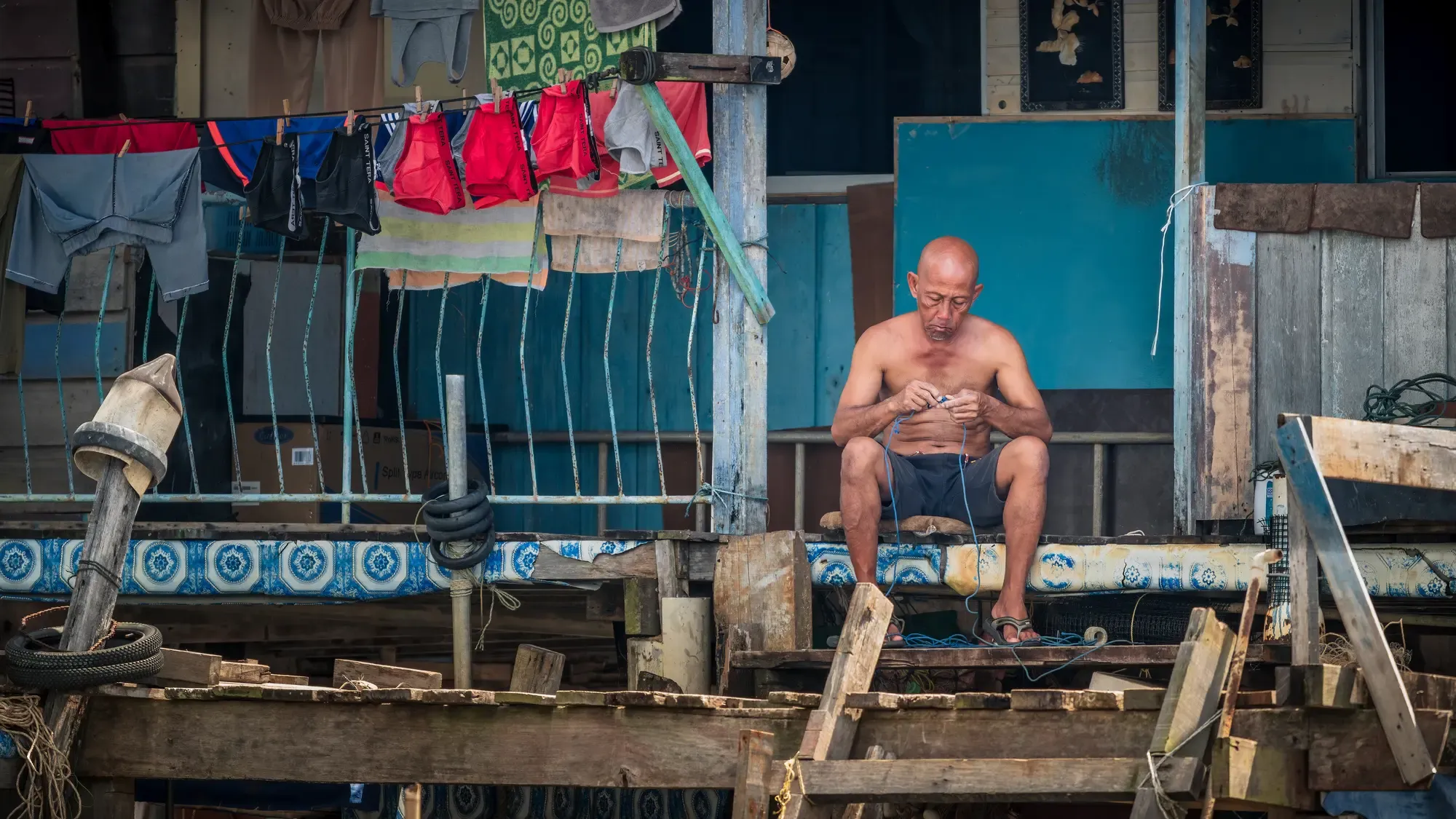Každodenní život ve vodní čtvrti Kampong Ayer